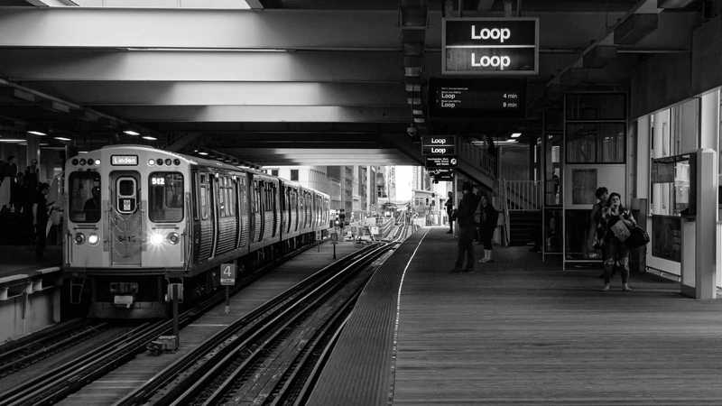 a train at the station in chicago with a sign that says loop